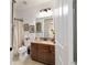 Bathroom featuring a granite vanity top and decorative wall art at 9532 Sw 70Th Loop, Ocala, FL 34481