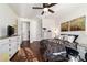 Bright bedroom with hardwood floors, dresser, and a view of closet doors at 9532 Sw 70Th Loop, Ocala, FL 34481
