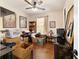 Bedroom with ceiling fan, laminate floors, and ample natural light at 9532 Sw 70Th Loop, Ocala, FL 34481