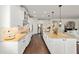 Modern kitchen with granite countertops, white cabinets and stainless steel appliances at 9532 Sw 70Th Loop, Ocala, FL 34481