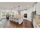 Bright kitchen features large island, pendant lights, stainless steel appliances and modern cabinetry at 9532 Sw 70Th Loop, Ocala, FL 34481