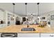 An open kitchen view with granite countertops and modern appliances in a open concept living area at 9532 Sw 70Th Loop, Ocala, FL 34481