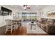 Cozy living room with hardwood floors and sliding glass doors at 9532 Sw 70Th Loop, Ocala, FL 34481