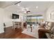 Cozy living room with hardwood floors and sliding glass doors at 9532 Sw 70Th Loop, Ocala, FL 34481