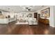 Open living area with hardwood floors, modern decor, and a connected kitchen at 9532 Sw 70Th Loop, Ocala, FL 34481