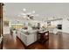 Open-concept living area with view, hardwood floors, and a modern, airy design at 9532 Sw 70Th Loop, Ocala, FL 34481