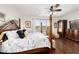 Spacious main bedroom with traditional furnishings, ceiling fan, and large windows at 9532 Sw 70Th Loop, Ocala, FL 34481