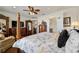 Bright main bedroom boasts traditional furnishings, walk-in closets, and an ensuite bath at 9532 Sw 70Th Loop, Ocala, FL 34481