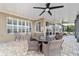 Screened-in lanai with a seating area and beautiful water views at 9532 Sw 70Th Loop, Ocala, FL 34481