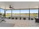 Screened-in lanai with beautiful water views and a ceiling fan at 9532 Sw 70Th Loop, Ocala, FL 34481