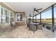 Screened-in lanai with a seating area and beautiful water views at 9532 Sw 70Th Loop, Ocala, FL 34481
