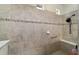 Tiled walk-in shower with seating and a shower head at 9532 Sw 70Th Loop, Ocala, FL 34481