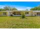 Expansive backyard with a screened porch and well-maintained lawn, ideal for relaxation and entertaining at 9638 Sw 94Th Ave # C, Ocala, FL 34481