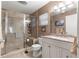 Elegant bathroom with glass shower, granite vanity, and neutral color scheme at 9638 Sw 94Th Ave # C, Ocala, FL 34481
