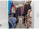 Walk-in closet with rods, shelves, and ample storage for clothes and accessories at 9638 Sw 94Th Ave # C, Ocala, FL 34481