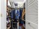 Walk-in closet with shelving, rods, and ample storage at 9638 Sw 94Th Ave # C, Ocala, FL 34481
