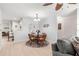 Cozy dining area featuring a round table, chairs, and view into the living room at 9638 Sw 94Th Ave # C, Ocala, FL 34481