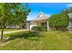 Attractive home with a green lawn, neatly trimmed bushes, and a paved driveway in a peaceful setting at 9638 Sw 94Th Ave # C, Ocala, FL 34481