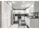 Well-lit kitchen with stainless steel appliances, white cabinetry, and ample counter space at 9638 Sw 94Th Ave # C, Ocala, FL 34481
