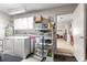 Bright laundry room with washer, dryer, storage cabinets, and easy access to the main living area at 9638 Sw 94Th Ave # C, Ocala, FL 34481