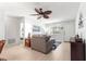 Cozy living room featuring comfortable seating, light wood floors, and bright natural light from the window at 9638 Sw 94Th Ave # C, Ocala, FL 34481