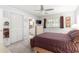 Main bedroom featuring ceiling fan, ample closet space, and attached bathroom at 9638 Sw 94Th Ave # C, Ocala, FL 34481