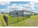 An expansive fenced backyard adds to the charm of the home with a screened in private pool at 8875 Sw 58Th Street Rd, Ocala, FL 34481