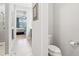 En suite bath features gray vanity and modern fixtures with tile floors at 8875 Sw 58Th Street Rd, Ocala, FL 34481