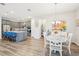 Kitchen with a center island with breakfast bar seating and adjacent dining area at 8875 Sw 58Th Street Rd, Ocala, FL 34481