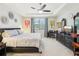 Spacious bedroom featuring neutral walls, decor and a tray ceiling with a ceiling fan for comfort at 8875 Sw 58Th Street Rd, Ocala, FL 34481