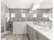 Spacious bathroom with double sinks, lots of counter space, and a separate glass enclosed shower at 10589 Sw 98Th Ln, Ocala, FL 34481