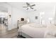 Cozy bedroom with wood floors and view into the kitchen at 10589 Sw 98Th Ln, Ocala, FL 34481
