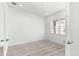 Bright and airy bedroom with hardwood floors, a window for natural light, and neutral color palette at 10589 Sw 98Th Ln, Ocala, FL 34481