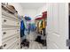 Walk-in closet featuring built-in drawers, shelving, and hanging rods at 10589 Sw 98Th Ln, Ocala, FL 34481