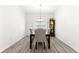 Dining room features wood floors and chandelier at 10589 Sw 98Th Ln, Ocala, FL 34481