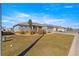 Spacious front lawn and landscaping complement this home's exterior, showcasing its curb appeal in the neighborhood at 10589 Sw 98Th Ln, Ocala, FL 34481
