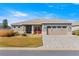 Charming single-story home featuring a well-maintained lawn, a two-car garage, and inviting curb appeal at 10589 Sw 98Th Ln, Ocala, FL 34481