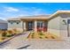 Inviting front porch featuring a paver walkway and entryway and offering a warm welcome at 10589 Sw 98Th Ln, Ocala, FL 34481