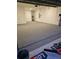 Spacious garage featuring durable epoxy flooring for a clean and modern aesthetic at 10589 Sw 98Th Ln, Ocala, FL 34481