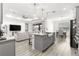 Open concept kitchen and living room with granite countertops and seamless flow for entertaining at 10589 Sw 98Th Ln, Ocala, FL 34481
