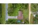 Bird's-eye view of home with well-maintained lawn and tree coverage at 1081 Se 170Th Ave, Silver Springs, FL 34488