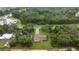 Aerial view showcases home with a long driveway and expansive lot at 1081 Se 170Th Ave, Silver Springs, FL 34488