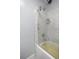 Simple bathroom features a white subway-tiled shower-over-tub and light blue painted walls at 1081 Se 170Th Ave, Silver Springs, FL 34488