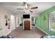 Bedroom with ceiling fan, television on chest, hard flooring, and closet with sliding mirror doors at 1081 Se 170Th Ave, Silver Springs, FL 34488