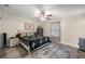 Bedroom with ceiling fan, area rug, queen bed, and hardwood flooring at 1081 Se 170Th Ave, Silver Springs, FL 34488