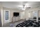 Bright bedroom with ceiling fan, dresser, rug, and connecting bath access at 1081 Se 170Th Ave, Silver Springs, FL 34488