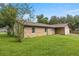 Charming single-story home featuring stone accents, a well-maintained lawn, and an attached two-car garage at 1081 Se 170Th Ave, Silver Springs, FL 34488