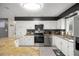 Well-equipped kitchen featuring stainless steel appliances, ample counter space, and modern fixtures at 1081 Se 170Th Ave, Silver Springs, FL 34488