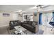 Comfortable living room with tile flooring, neutral walls, and easy access to kitchen and outdoor spaces at 1081 Se 170Th Ave, Silver Springs, FL 34488