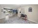 Open-concept layout with views into the kitchen and living area with tile floors and light filled spaces at 1081 Se 170Th Ave, Silver Springs, FL 34488